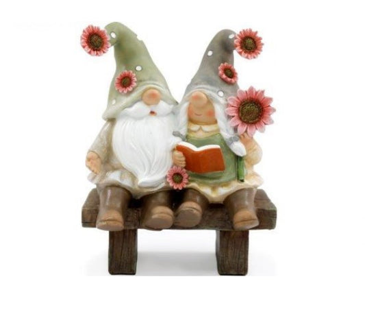 Gnomes Sitting on a Bench With Sunflowers